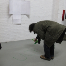 03-they write UCK OCUS on the floor with green drab
